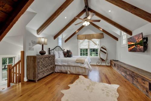 a bedroom with a bed and a ceiling fan at 7Cs Sunset Valley Ranch in Fredericksburg