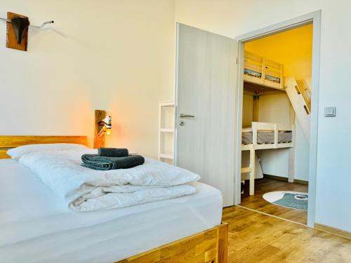 a bedroom with a bed and a bunk bed at b3 - bike & bed bitterfeld in Bitterfeld