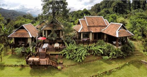 an aerial view of a house in the forest at Kanlaya's Eyrie, Luxury Homestay in Pang Mapha