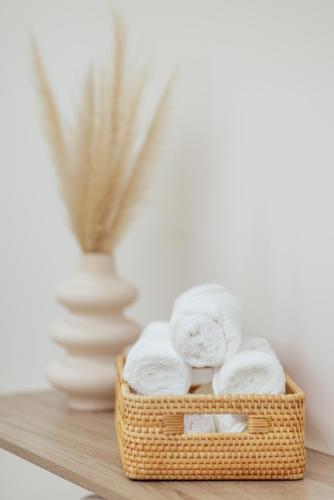 a basket of towels sitting on a table at Hotel ORJEN sport & pleasure in Trebinje