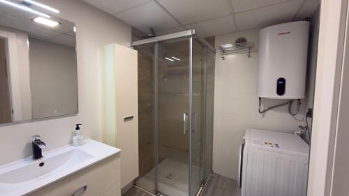 a bathroom with a shower and a sink at Turquesa 10 in La Pineda