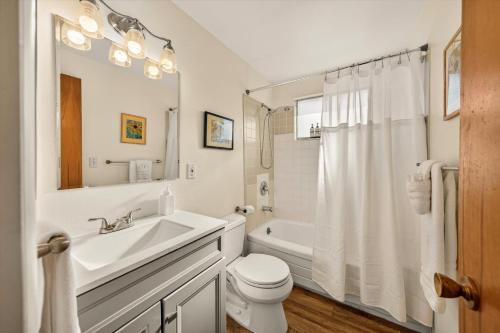 a white bathroom with a sink and a toilet at Red Ivy #5 in Boise