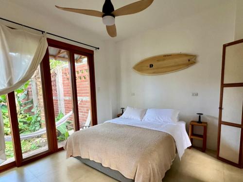 a bedroom with a bed and a ceiling fan at Casa Isla - Private Retreat in Galapagos in Puerto Baquerizo Moreno