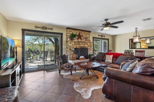 a living room with a couch and a tv at 2 Creeks in Wimberley
