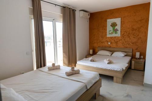 Llit o llits en una habitació de Villa Elezi