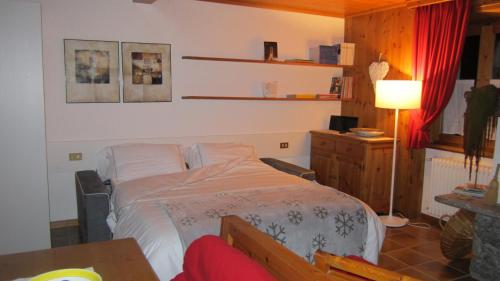 En eller flere senge i et værelse på Casa Martinelli - Trameri