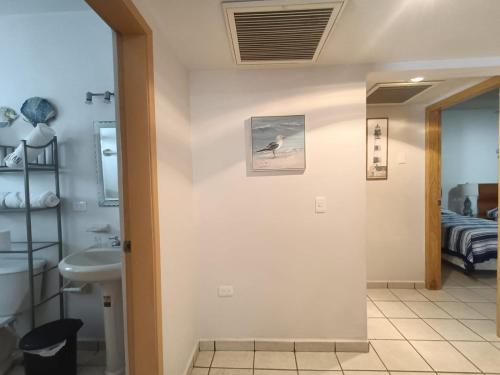 a bathroom with a toilet and a sink at Villa Serena Erizos 2 in San Carlos
