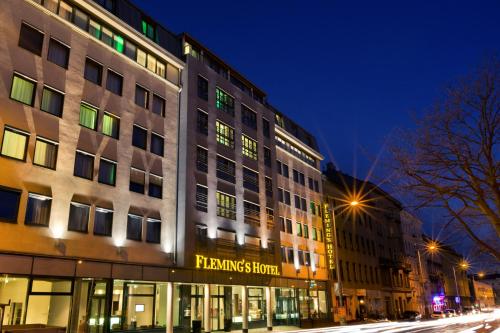 a building on a city street at night at Flemings Hotel Wien-Stadthalle in Vienna