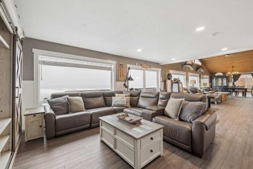 a living room with a couch and a table at Neptune's Watch in Gleneden Beach