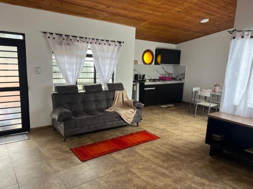 a living room with a couch and a table at Casa Armonía Popayán in Popayan