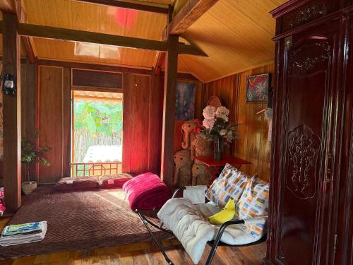 a room with a bed and a bed frame in a room at The Bare Nest Retreat - Xóm Đung Homestay in Hòa Bình