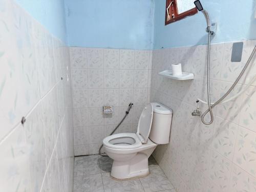 a bathroom with a toilet and a shower at Hidden Valley Pai in Pai