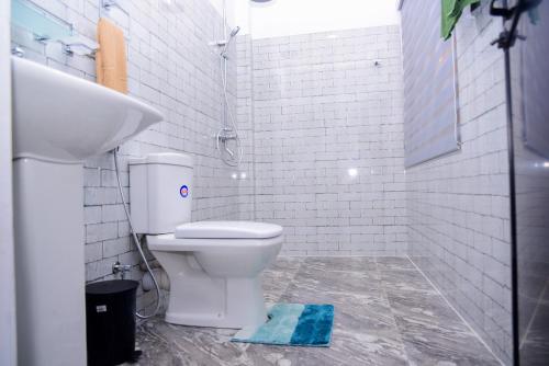 a bathroom with a toilet and a sink at Ella Breathing Space in Ella