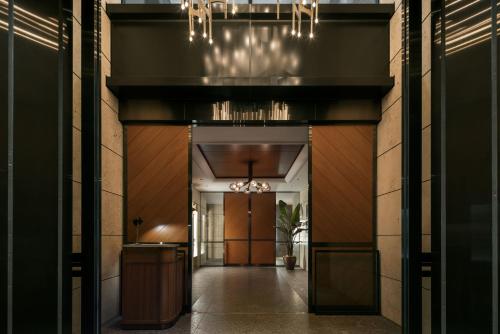 a hallway leading to a building with a hallwayngth at THE AOYAMA GRAND HOTEL in Tokyo