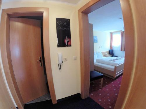 a room with a door leading to a bedroom at Appartement Pension St. Sebastian in Pettneu am Arlberg