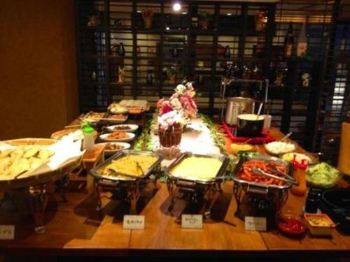 a table with many different types of food on it at Hotel Crown Hills Kokura in Kitakyushu