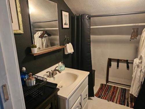 a bathroom with a sink and a shower at Tranquility at the House of Alchemy Hollywood in Los Angeles
