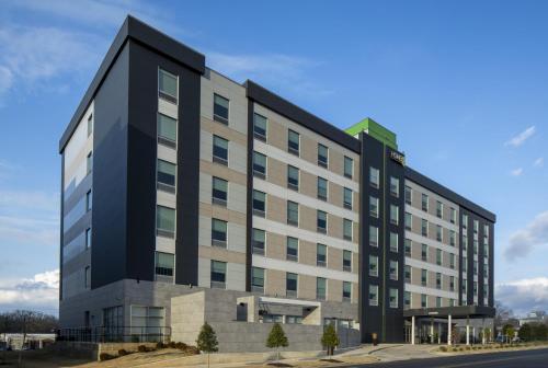 a large black and white building on a street at Home2 Suites By Hilton Montgomery Downtown in Montgomery