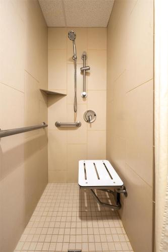 a bathroom with a toilet and a shower at DoubleTree by Hilton Hotel Houston Hobby Airport in Houston