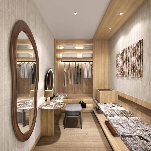 a dressing room with a mirror and a chair at The Westin Nirup Island Resort & Spa in Belakangpandang