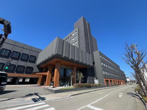a large building on the corner of a street at Tokigasane in Kaga