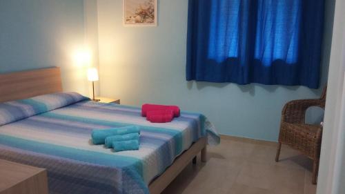 Ένα ή περισσότερα κρεβάτια σε δωμάτιο στο Profumo di Mare