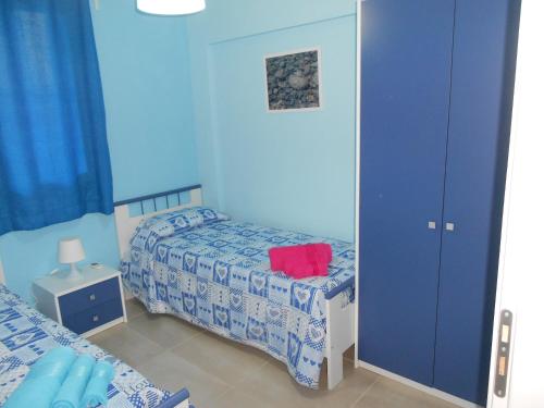 Ένα ή περισσότερα κρεβάτια σε δωμάτιο στο Profumo di Mare