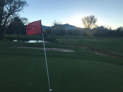 a golf course with a flag on a green at Hostel Fish in Denver