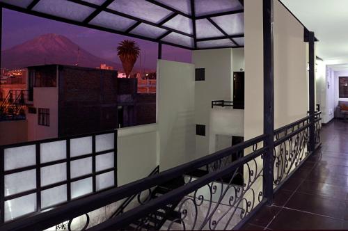 a balcony of a building with a view of a mountain at Hoteles Riviera Mansion in Arequipa
