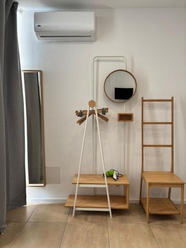 a room with a ladder and a mirror and a shelf at A Casuzza di Giú Giú - NUOVA GESTIONE in Agrigento