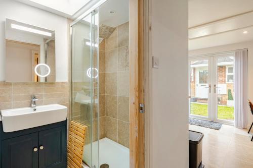 a bathroom with a sink and a shower at SkylightAnnex in Gaywood