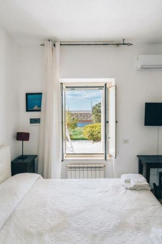 Llit o llits en una habitació de Villa Catalano
