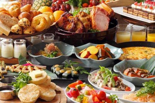 a table filled with lots of different types of food at RIHGA Royal Hotel Kyoto in Kyoto