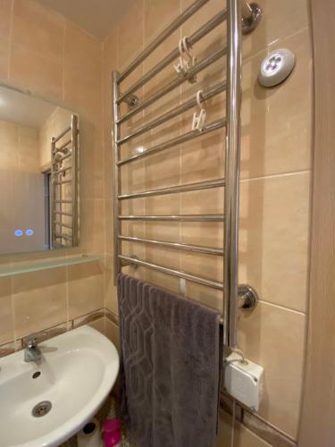 a bathroom with a sink and a toilet and a mirror at Изгрев-Бяла in Byala