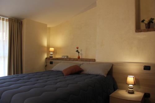 En eller flere senge i et værelse på Hostel del Gal