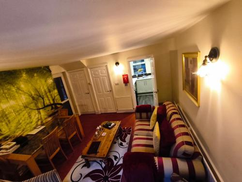 a living room with a couch and a table at No6 High Street in Edwinstowe