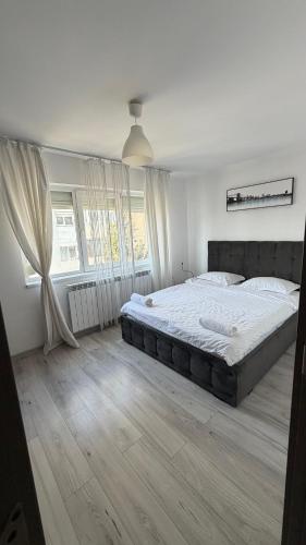 a bedroom with a large bed in a room at Lion Crib in Bacău