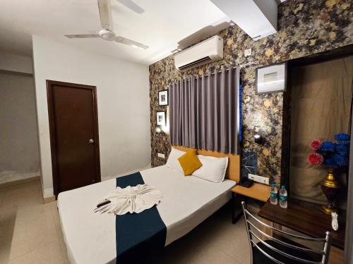 a bedroom with a bed in a room at hotel Prime Plaza Newtown in kolkata