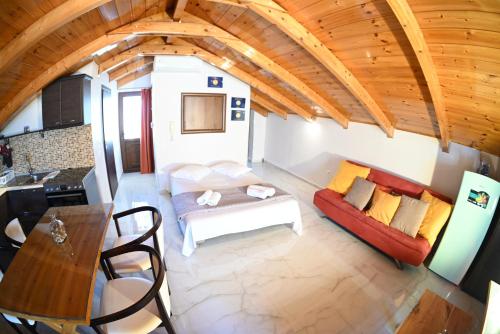 a living room with a couch and a table at Studio Gio in Zakynthos City in Zakynthos