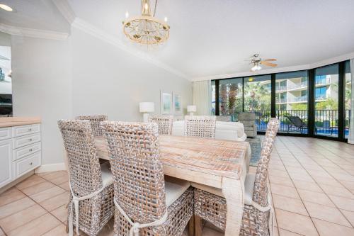 a dining room with a table and chairs at Phoenix on the Bay 1124 in Orange Beach