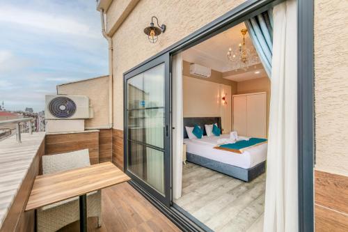 a balcony of a hotel room with a bed at Marnas Hotels in Istanbul