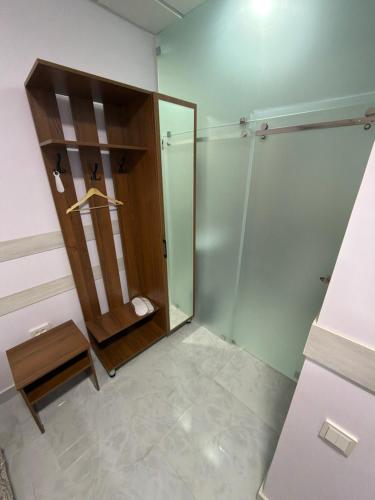 a bathroom with a shower and a mirror at Hotel Sofia Samarkand in Samarkand