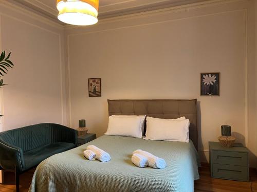 a bedroom with a bed with two towels on it at Appartamento Nicole 20 in Menaggio