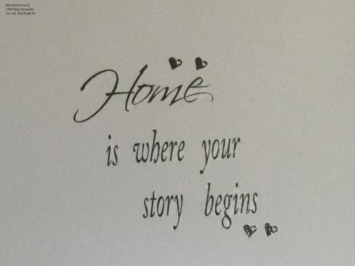 a white paper with a letter with the words home is where your story begins at Bed & Breakfast Region Murtensee in Münchenwiler