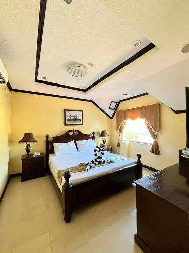 a large bedroom with a large bed in a room at PALM TREE RESORT AND RESTAURANT in Olongapo