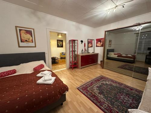 a bedroom with a bed and a large glass window at Goetheanum Casa in Dornach