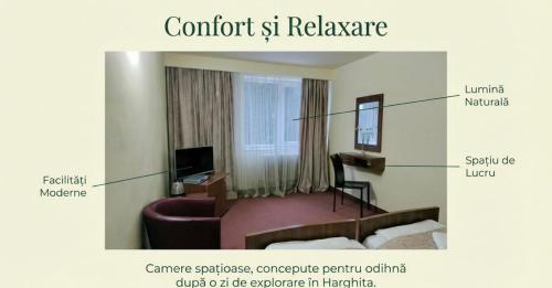 Un televizor și/sau centru de divertisment la Hotel Iasicon