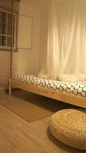 a bed in a room with a wooden frame at Casa da Quelha in Chãs de Égua