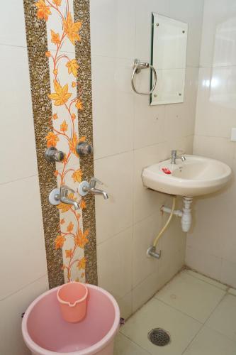 a small bathroom with a sink and a toilet at Hotel The Bliss Near Housing Board Chowk Mani Majra Chandigarh in Chandīgarh