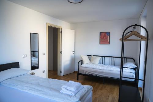 a bedroom with two bunk beds and a mirror at Villa Leo in Koper